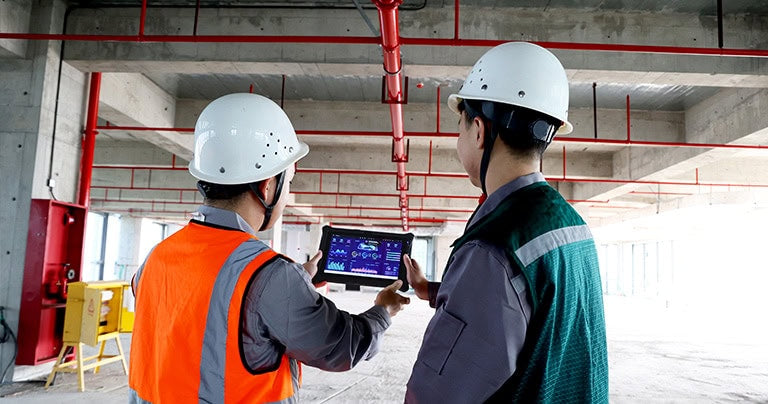 The I10AI enhanced tablet is used by construction site designers to view blueprints.