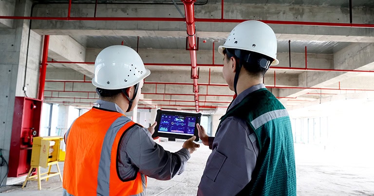 The I10AI enhanced tablet is used by construction site designers to view blueprints.