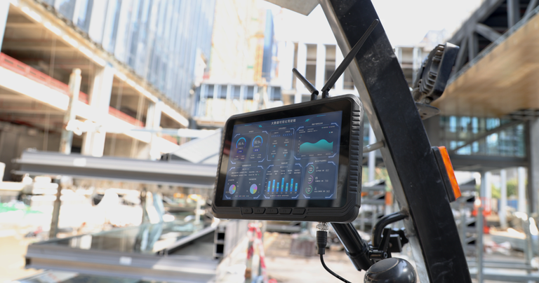 Industrial vehicle mounted computer installed on a forklift for warehouse logistics and fleet management.